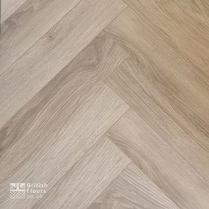 Wooden flooring with herringbone pattern and 'British Floors' logo.